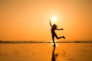 abstract silhouette of happy young jumping girl, healthy life